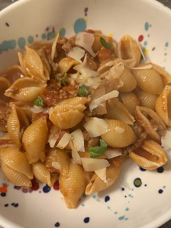 Pasta shells with bolognese sauce and parmesan